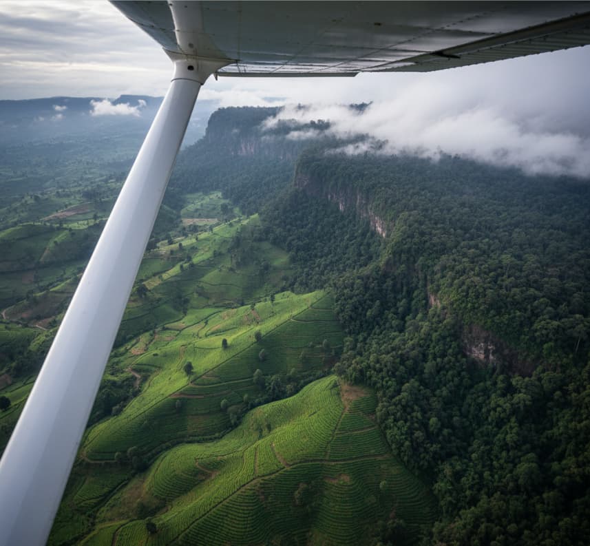 4 Days Gorilla Flying Adventure 5 A breathtaking aerial view of the Bwindi forest and rolling hills during a scenic domestic flight from Entebbe to Kihihi Airstrip.