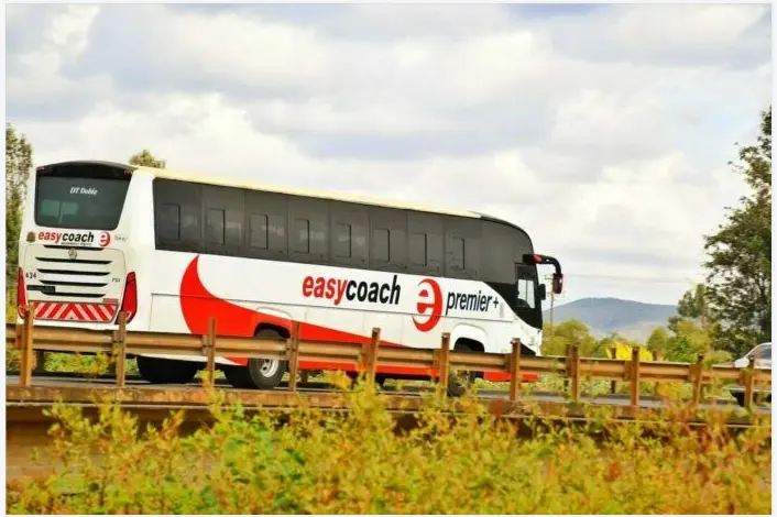 An Easy Coach bus on the road providing executive transport from Nairobi to Nakuru in 2026.
