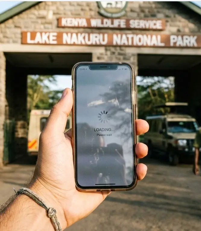 Traveler attempting eCitizen payment for Lake Nakuru park fees at the main entrance gate.