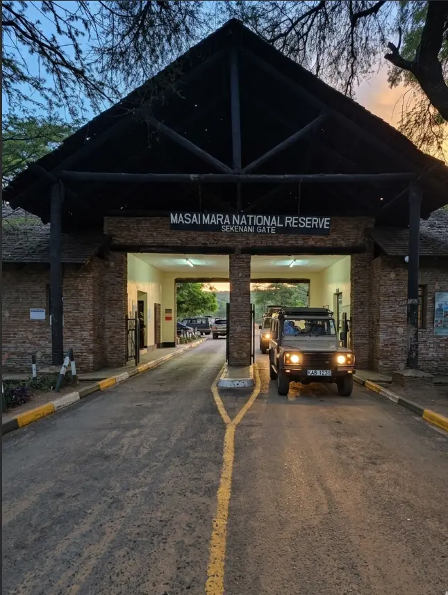 A safari vehicle waiting at the Sekenani Gate of Masai Mara for the 6:00 AM opening.