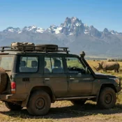Private 4x4 Land Cruiser on a luxury safari with Mount Kenya in the background.